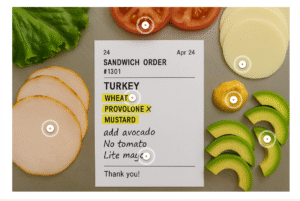 Screenshot of a clickable order ticket activity where learners can select ingredients to simulate fulfilling a customer’s sub order.